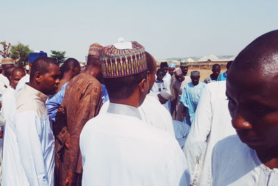 People standing against clear sky