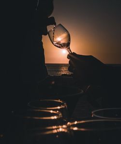 Close-up of illuminated light glass of wine