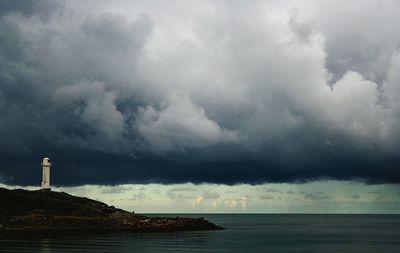 Scenic view of sea against cloudy sky