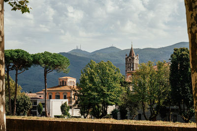 Buildings in city against sky