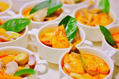 Close-up of fish curry in mug