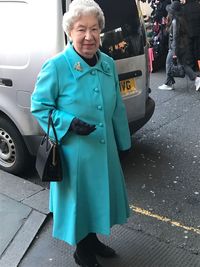 Portrait of woman standing outdoors