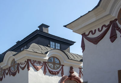 Low angle view of building against blue sky