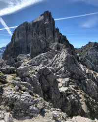 Rock formation on landscape against sky