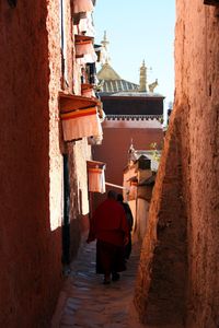 Monks in alley at tibetan monastery 