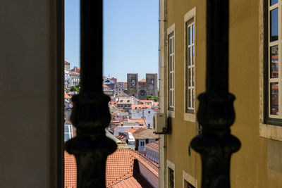 Lisbon cathedral in town seen through window