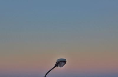 Close-up of electric light against clear sky