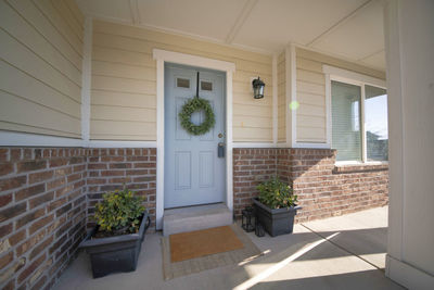 Potted plants outside house at home