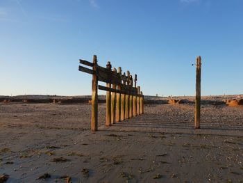 Lifeguard hut on beach against clear sky