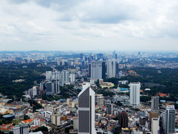 Aerial view of cityscape against sky