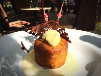 Close-up of served cake with ice cream in plate