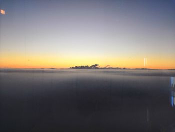 Scenic view of sea against clear sky during sunset