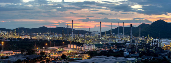 High angle view of illuminated buildings against sky during sunset