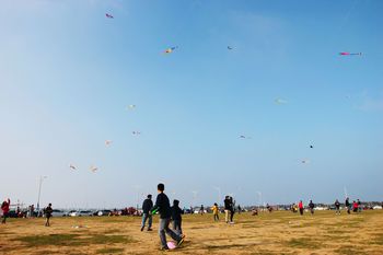 People enjoying at park against clear sky
