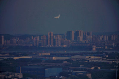 Aerial view of buildings in city at night