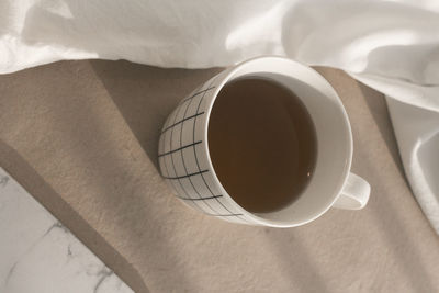 High angle view of coffee cup on table