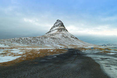 Scenic view of snowcapped mountain against sky