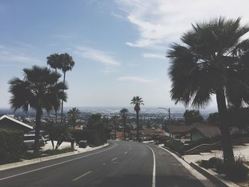 Road in city against sky