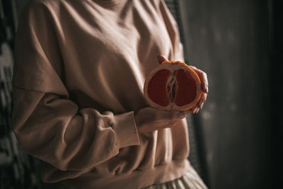 Close-up of hand holding fruit