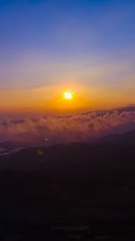 Scenic view of silhouette landscape against romantic sky at sunset