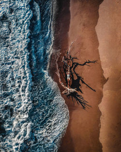 High angle view of rock formation in sea