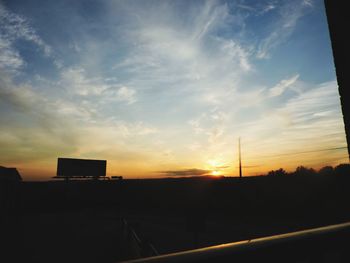 Silhouette buildings against sky during sunset