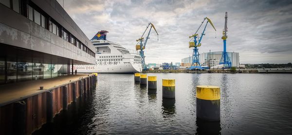 Pier at harbor against sky
