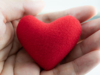 Close-up of hand holding heart shape