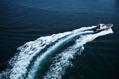 Vapor trail behind motor boat