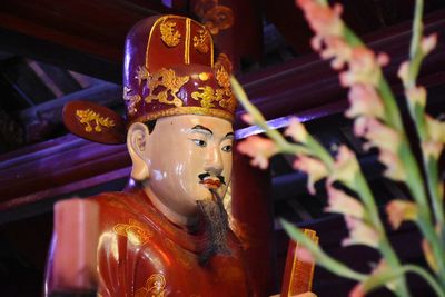 Close-up of statue against temple