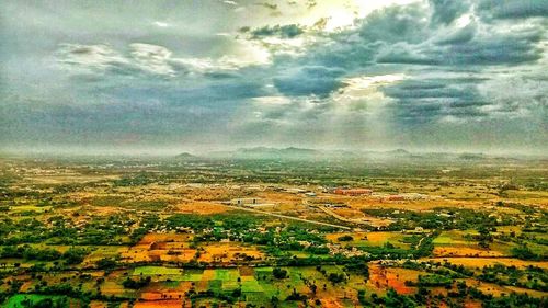 Aerial view of agricultural field against sky