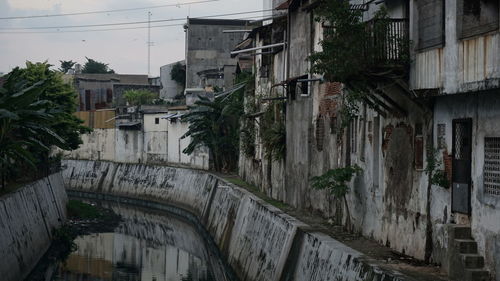 Street amidst buildings against sky