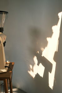High angle view of illuminated lamp on table by sea