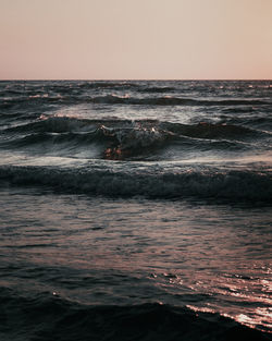 Scenic view of sea against clear sky during sunset