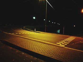 Illuminated road at night