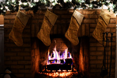 View of candles on wooden wall