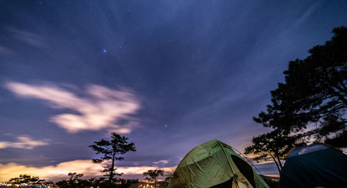 Low angle view of tent against sky at night