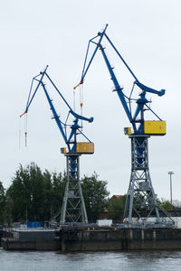 Crane at construction site against clear sky