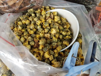 High angle view of dry chrysanthemum flowers for sale at market stall