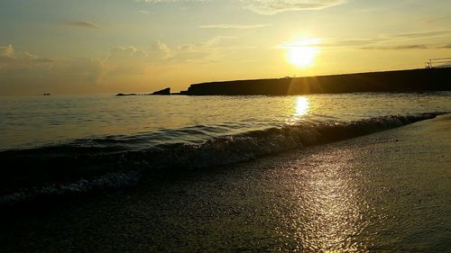 Scenic view of sea at sunset