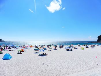 Scenic view of beach against blue sky