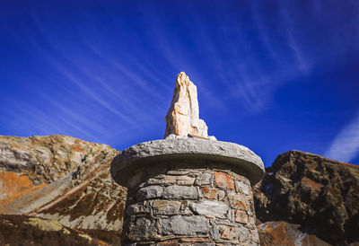 Low angle view of statue against sky