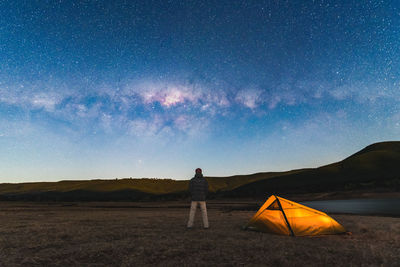 Man looking at sky at night