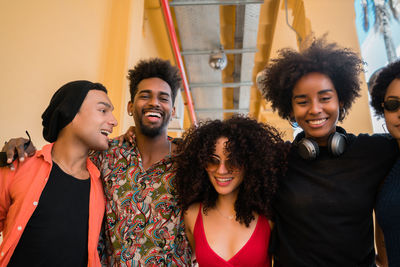 Portrait of smiling friends standing outdoors