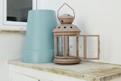 Close-up of white container on table at home