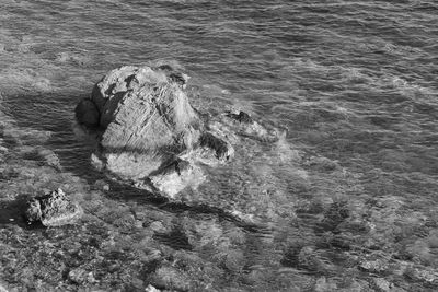 High angle view of rock formation in sea