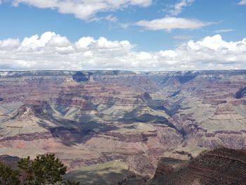 Scenic view of dramatic landscape against cloudy sky