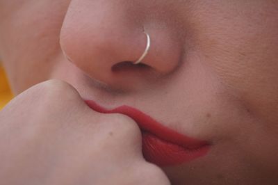 Close-up of woman lips kissing hand