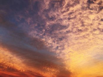 Low angle view of dramatic sky during sunset