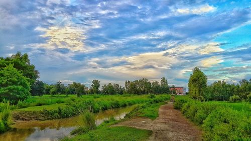 Scenic view of landscape against cloudy sky